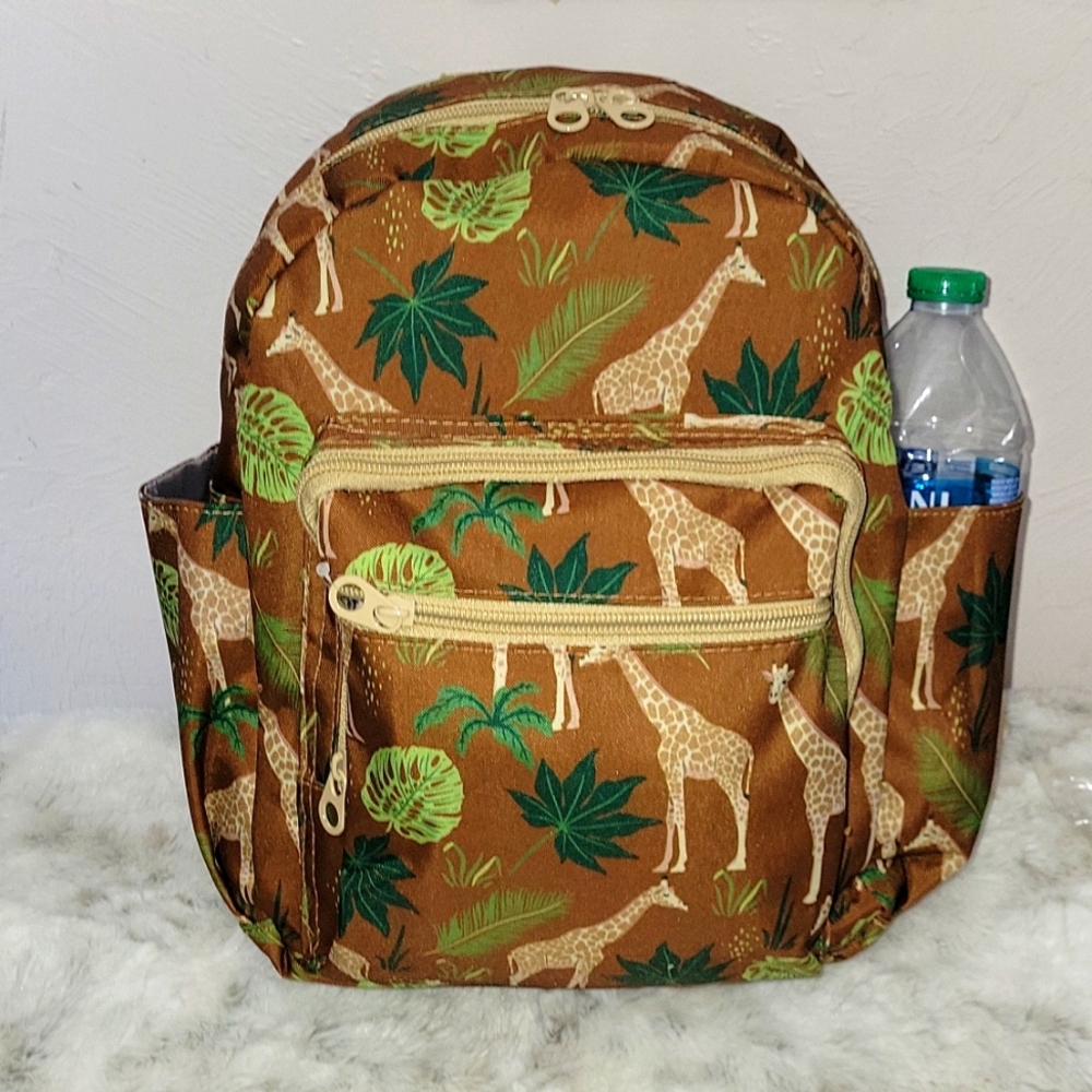 NEW, Giraffe canvas medium backpack. Two side pockets good for water bottles.